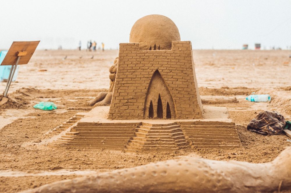 close up of sandcastle built in the beach